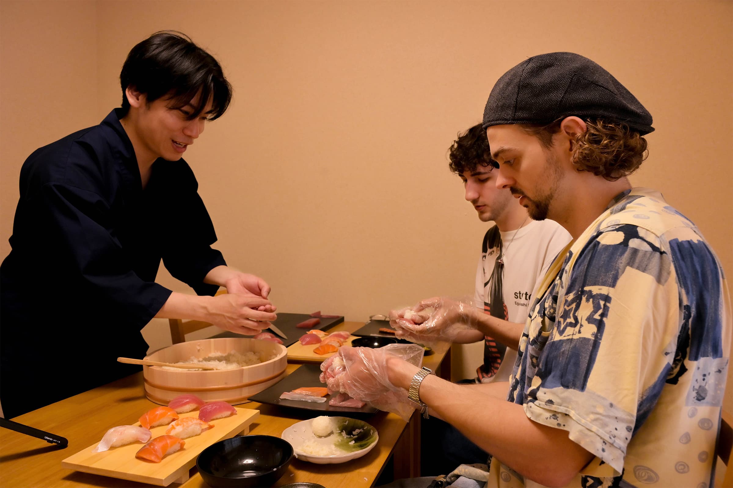 Guest making sushi during the experience